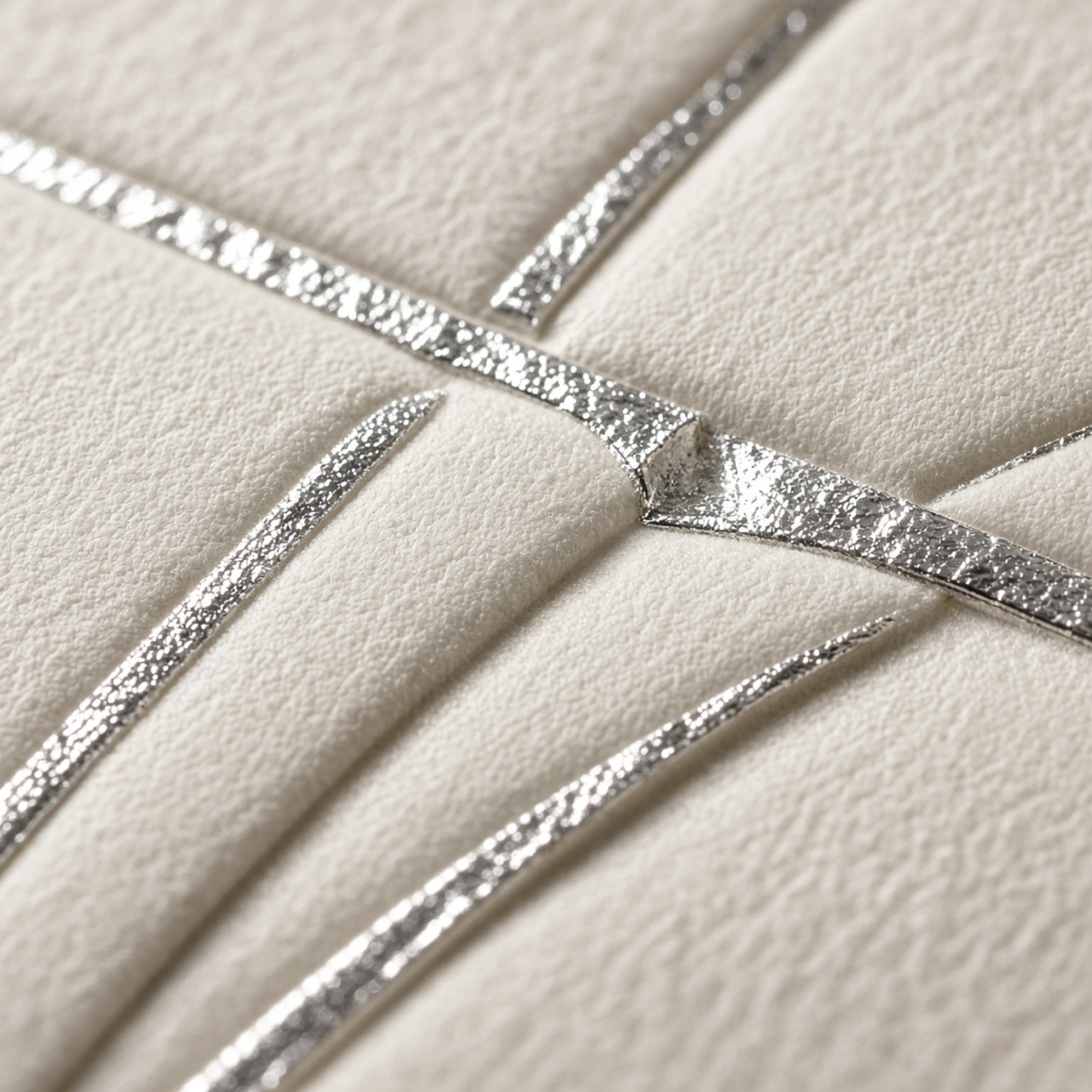 Silver foil pressed into ivory cotton paper